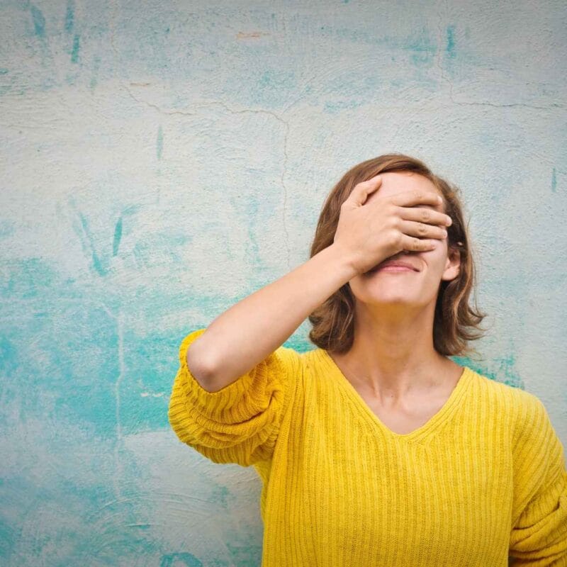 Woman tapping here eyes